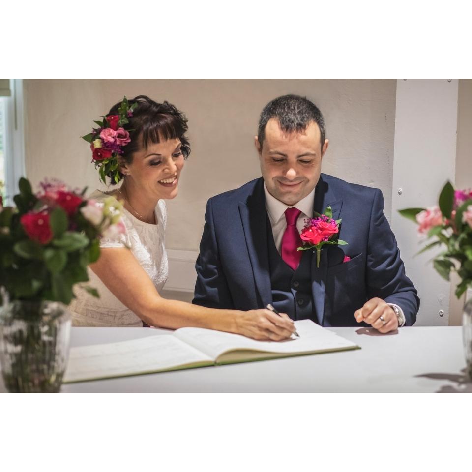 Couple signing the register