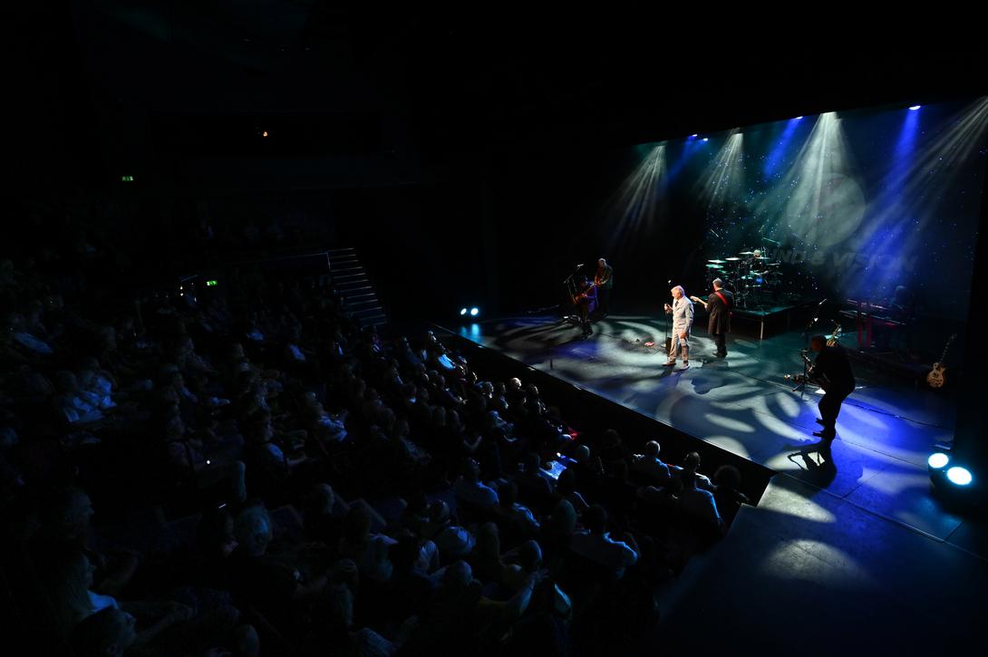 Photo of the band on a stage