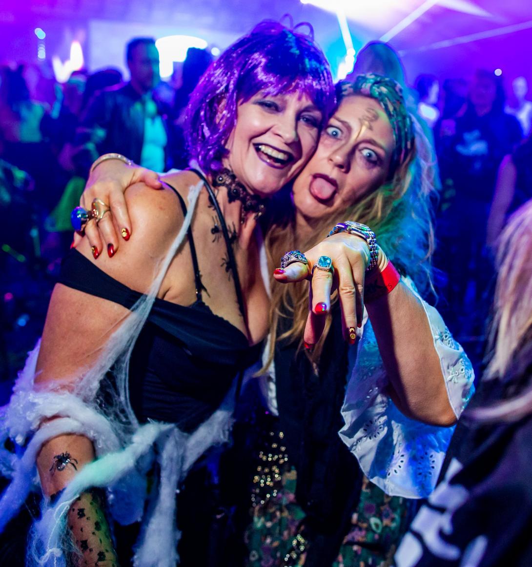 Photo of two attendees in costume for the Halloween event