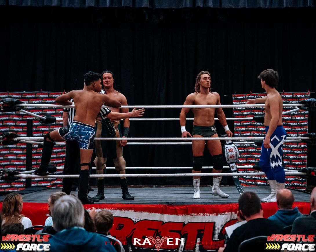 Four wrestlers in the ring